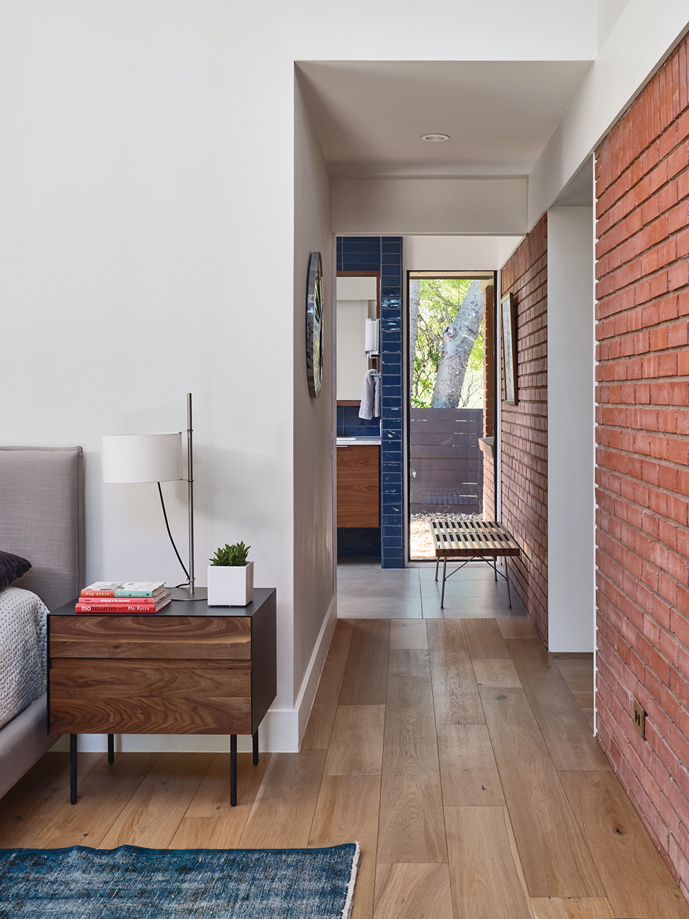 short hallway connecting a master bath to a bedroom.