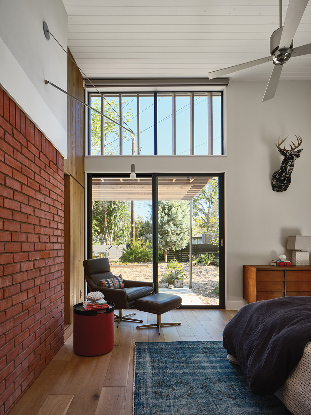 glass sliding doors leading to back yard from a bedroom.