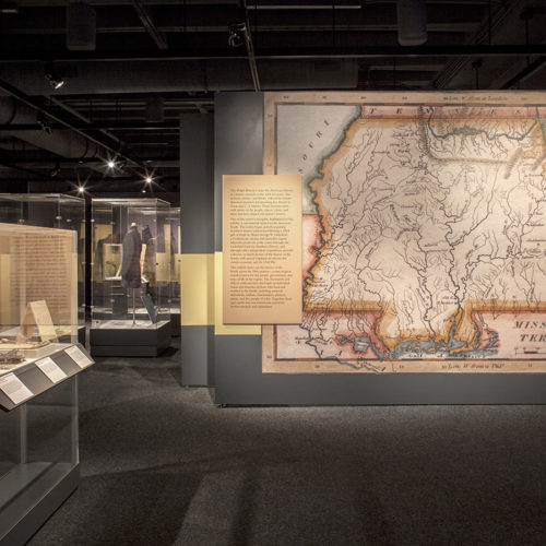Exhibit wall with large graphic of historic map that reads "Mississippi territory".