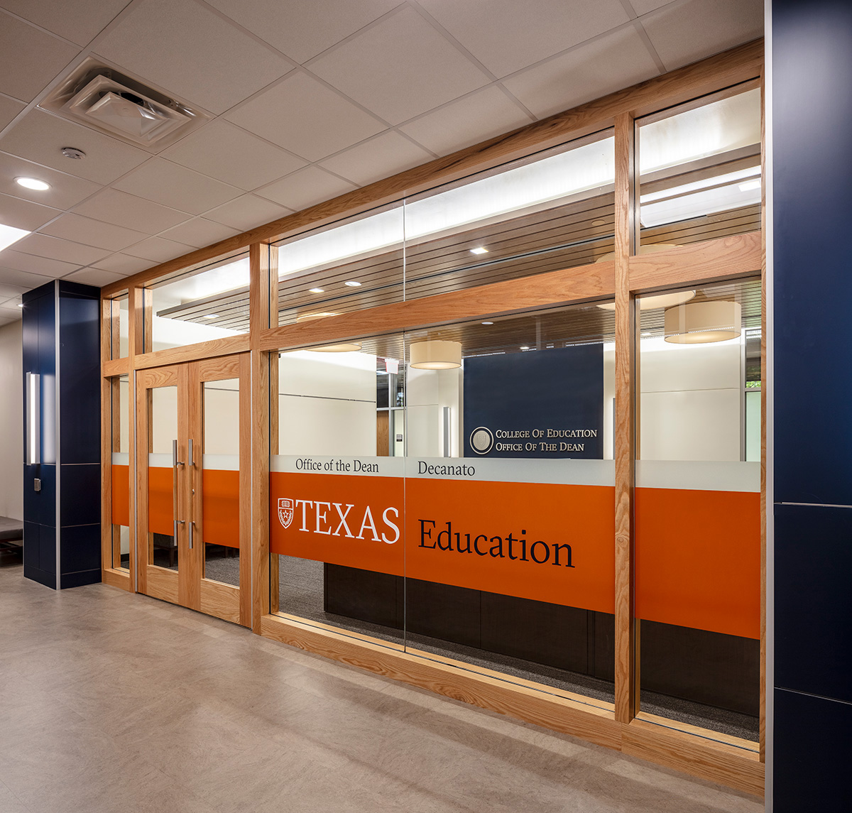 Glass and wood entrance to the Office of the Dean.