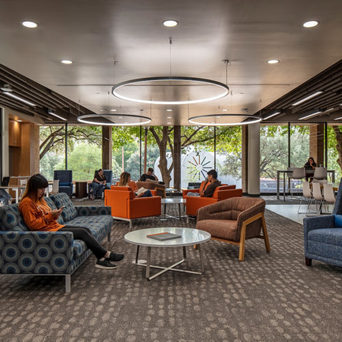 Students working in communal seating area.