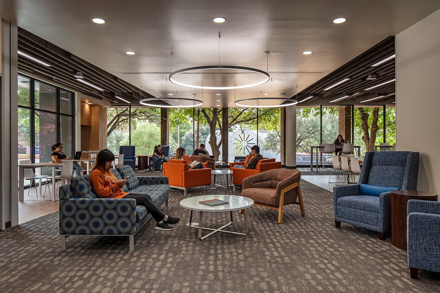 Students working in communal seating area.