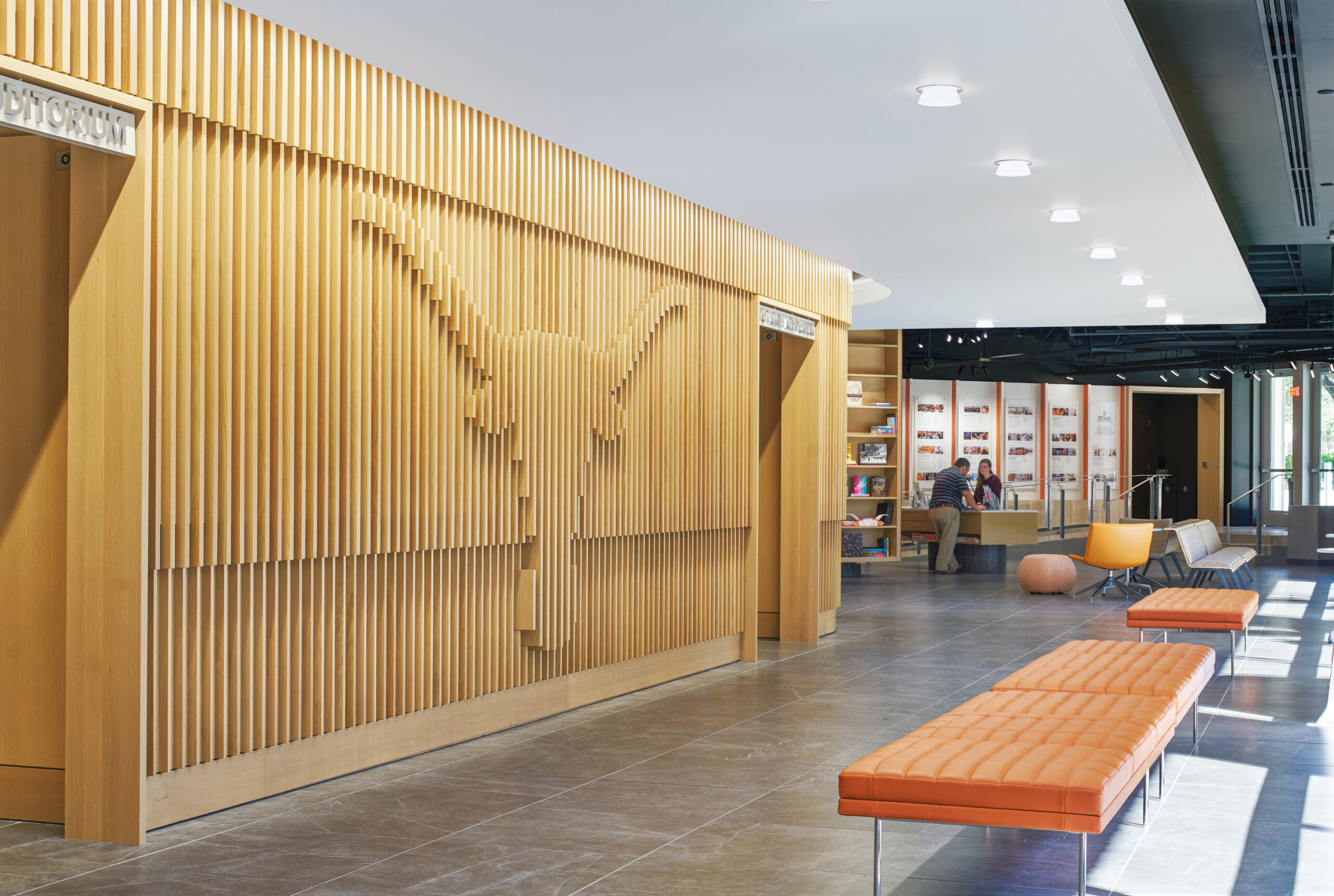 image of Welcome Center at the University of Texas at Austin, wood slat panel wall with longhorn logo detail