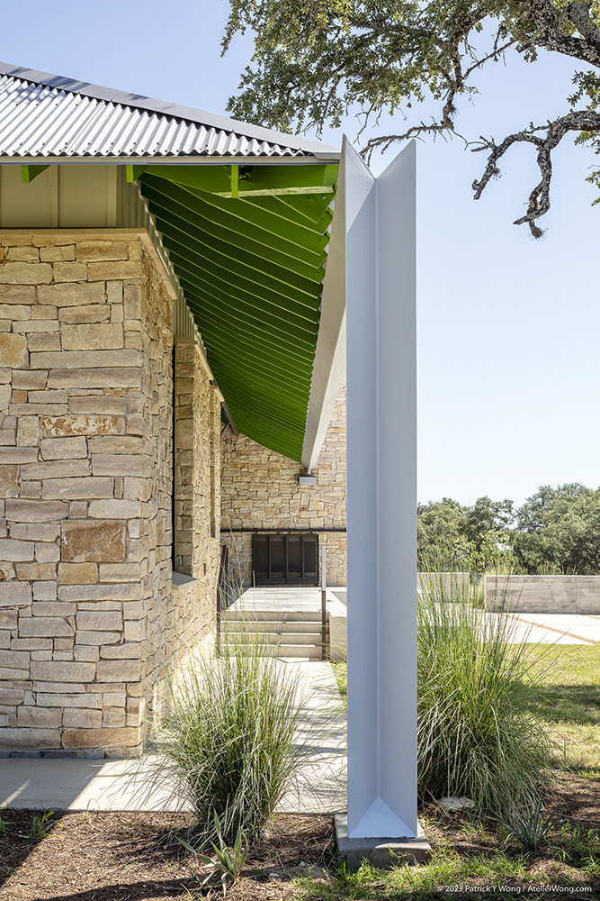 View of a gutter and downspout with triangular profile.