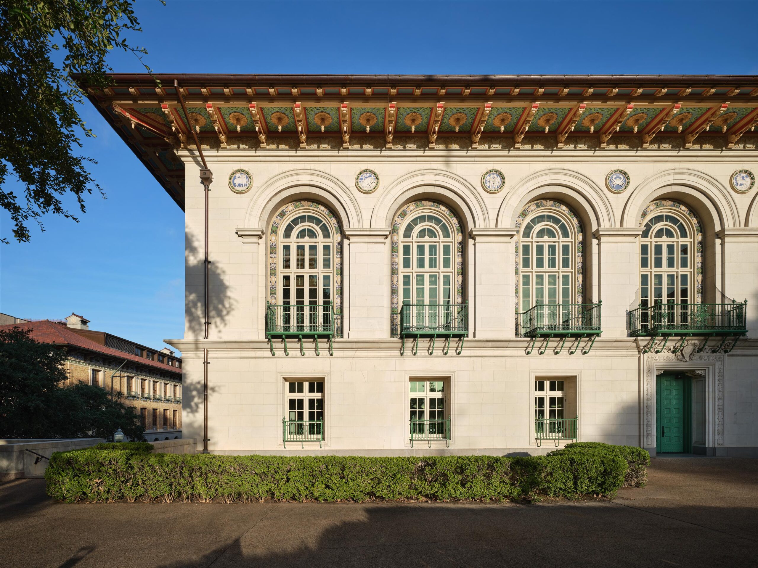 Front facade of a historic Spanish-Mediterranean Revival style building.